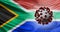 A South African flag with a Covid-19 virus. South African variant