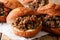 South African food: deep-fried vetkoek sandwich with meat curry