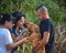 South African Mastiff breeder holds two brown puppies