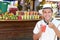 South American man in traditional fruit shop