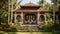 A South Asian bungalow with ornate architecture, surrounded by a tropical garden.