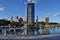 The South Bank Brisbane, beach in city centre with people and tall modern glass skyscrapers 1 William Street in background