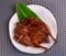 South East and East Asia: Typical Asian Food, Grilled whole duck served on the plate