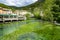 South of France, view on small Provencal town of poet Petrarch Fontaine-de-vaucluse with emerald green waters of Sorgue river