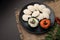South indian food idli coconut chutney with curry leaves and red chillies