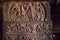 South Indian people and life in ancient villages, carved wall inside the 7th century temples in Pattadakal, India.