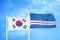 South Korea and Cape Cabo Verde two flags on flagpoles and blue cloudy sky