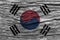 South korea flag with high detail of old wooden background .