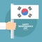South Korea Happy Independence Day celebration card with hand holding korean national flag.