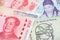 South Korea Won and China Yuan banknotes close up image.