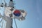 South Korean flag flapping on white mast of a merchant container ship with red and  white navigational lights.