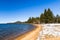 South Lake Tahoe shoreline and sandy beach, on a sunny day; California