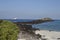 South Plaza Island coast with a small cruise ship offshore