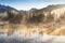 South Sister and Broken Top reflect over the calm waters of Sparks Lake at sunrise in the Cascades Range in Central Oregon, USA in