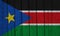 South Sudan Flag Over Wood Planks