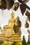 South Thailand, Phuket, Big gold Buddha and hanging gold praying bells
