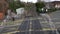 South Western Railway Train is Arriving to the Station and Crossing in Farnham, England. People And Vehicles are Going through the