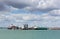 Southampton Docks with big cruise ship and cargo vessel on calm summer day with fine weather blue sky and white clouds