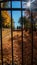 SOUTHBRIDGE, MASSACHUSETS. USA - NOVEMBER 17 2017. View of an old cemetery and graves trough the gate bars in Autumn fall hallowee