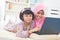 Southeast Asian children surfing internet