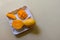 Southeast Asian fruit, fresh hedgehog style Mango preparation, cubes and chunks on white plate, isolated on a white background.