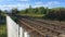 Southeastern train speeding past railway crossing on track near Canterbury, Kent, England, UK.