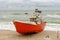 Souther Baltic sea coast, Northern Poland, Pomerania, sandy beach, dramatic sky, late winter time, fishing boat on the sand