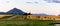 The Southern Alps over a barley field at sunset in Wanaka Otago New Zealand