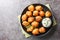 Southern Hush Puppies are light and flakey cornmeal dough that is fried golden brown on the outside and soft on the inside closeup