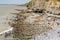 SOUTHERNDOWN, WALES - JUNE 10 2021: Crowds gather on the rocky and beach at Southerndown Dunraven Bay on the Glamorgan Heritage