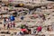 SOUTHERNDOWN, WALES - JUNE 10 2021: Crowds gather on the rocky and beach at Southerndown Dunraven Bay on the Glamorgan Heritage