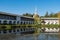 Southwest Ð¡orner tower and the wall of the Tikhvin Assumption Assumption Monastery with reflection in the pond. Tikhvin,