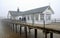 Southwold pier on a foggy day with the end in mist.