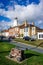 Southwold`s iconic lighthouse seen behind houses with cannon in foreground in Southwold, Suffolk, UK