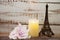 Souvenir Eiffel and Flameless Candles with flower decoration on wooden background