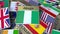 Souvenir magnet or badge with Abuja text and national flag among different ones. Traveling to Nigeria conceptual 3D