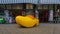 Souvenir shop with gigantic yellow clog in front of the shop window, Delft, Netherlands