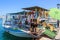 Souvenir shop, organised on fishing boat at port of Chania