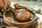 Souvenirs of clay wine jug on clay dish with relief pattern