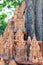 Souvenirs in shape of a red clay temple in a trading shop