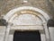 SOVANA, TUSCANY, ITALY - JUNE 16, 2019 - Entrance to the Concattedrale dei Santi Pietro e Paolo aka Duomo Cathedral of
