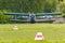 Soviet aircraft biplane Antonov AN-2 parked on a green grass of airfield