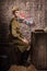 Soviet female soldier in uniform of World War II in the dugout