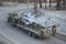 A Soviet-made military truck is transported by a broken helicopter