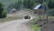 Soviet offroad car moving on rural road with hay