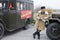 Soviet soldier standing near army lorry