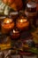 Soy candles burn in glass jars. Tree leaves, pumpkin. Comfort at home. Candle in a brown jar. Scent and light. Scented