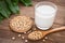 Soy milk and soy bean on wooden background