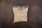 Soy Protein isolate in transparent plastic bag on brown background. Pure powder isolated from soybean often used in food industry