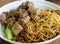 Soy sauce based pieces of beef stewed briskets on Asian egg noodles